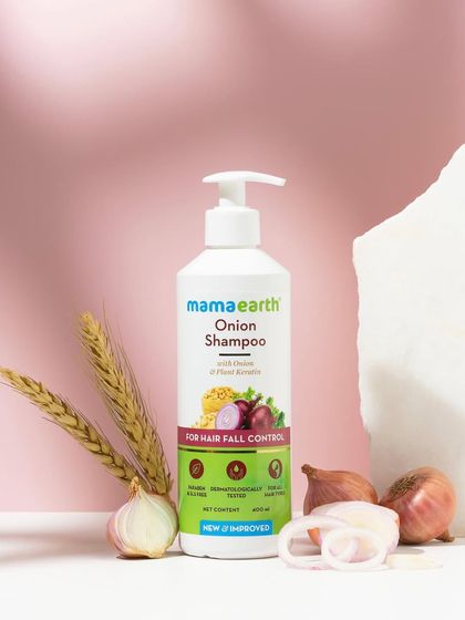 We used dramatic lighting to cast interesting shadows in this ingredient-focused shot for an onion shampoo. The composition with raw onions and stone props feels earthy and powerful.