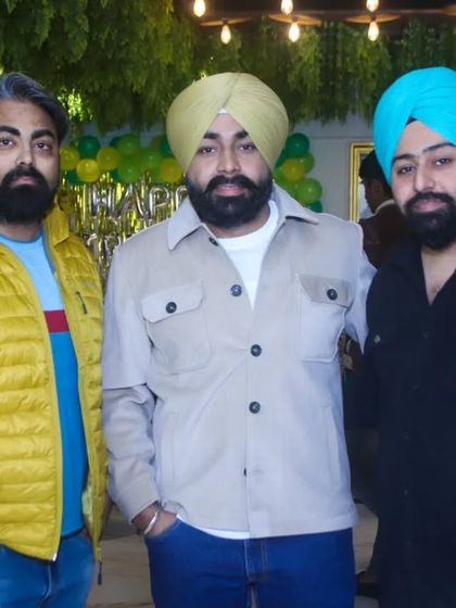 A posed photograph of three friends at a family function. We make sure to get sharp, well-composed shots of your guests.