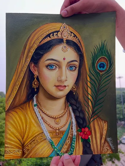 Holding the finished Radha ji painting. It feels special to create something that connects people to their faith.