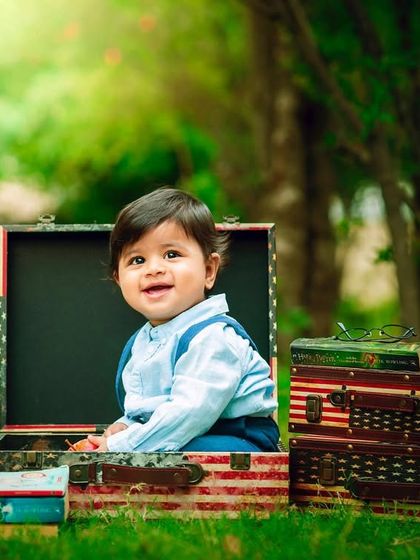 Sitting inside the suitcase, this little one is ready for his next journey.