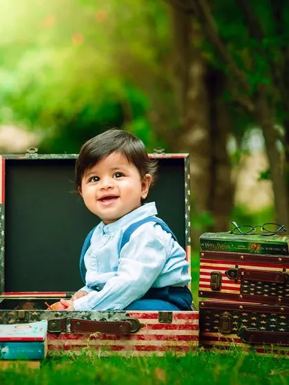 Sitting inside the suitcase, this little one is ready for his next journey.
