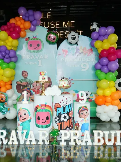 We love a creative challenge, like blending two themes into one party! For brothers Pravar and Prabuddh, we combined a Cocomelon theme for the first birthday with a sports theme for the ninth, using colourful balloons, character cutouts, and subtle sports elements for a unique celebration.