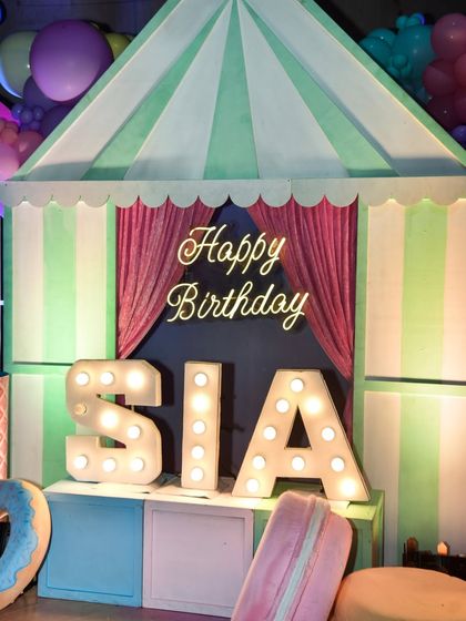 A close-up of the personalized marquee letters for the birthday girl at the Candyland party.