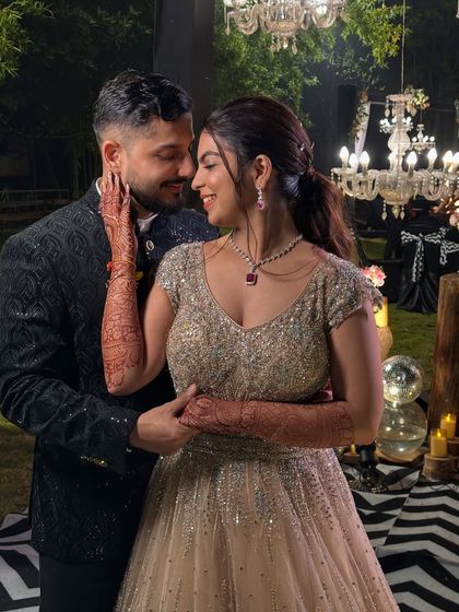 An intimate couple portrait. Her makeup is soft and romantic, with a focus on her beautiful eyes and radiant skin.