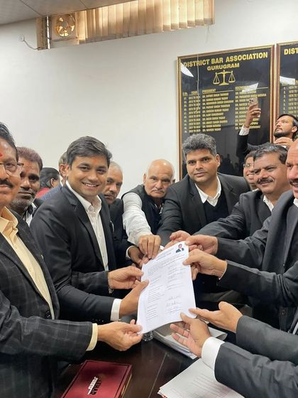 The collective strength of my supporters is visible as we hold up the nomination form together.