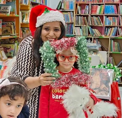 Getting into the festive spirit with fun props at our Christmas photo booth. It's these little moments of playfulness that make our events so special for the kids.