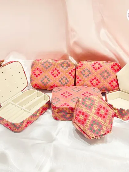 A collection of our customizable wedding jewelry boxes, available in different shapes and traditional fabrics.