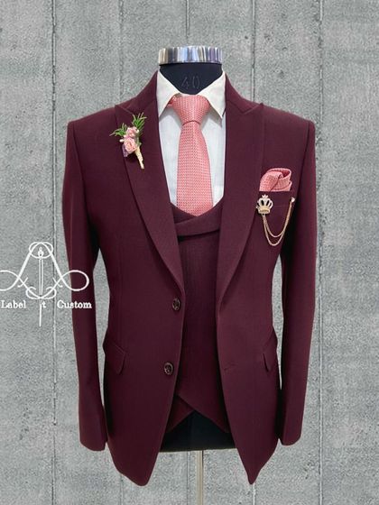Another view of the maroon three-piece suit, showcasing its flawless tailoring. A custom-made suit ensures a perfect fit that makes you feel like you're wearing a masterpiece created just for you.