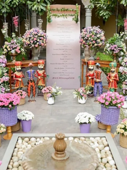The welcome area, featuring a personalized itinerary, traditional Rajasthani puppets, and an abundance of fresh flowers.
