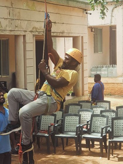 A participant practices jummaring, a technique for ascending a fixed rope.