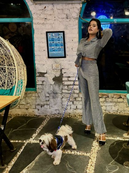 Coco to my Chanel. A stylish guest posing with her equally fashionable Shih Tzu. Our cafe is a great spot for that perfect Instagram picture with your pup.