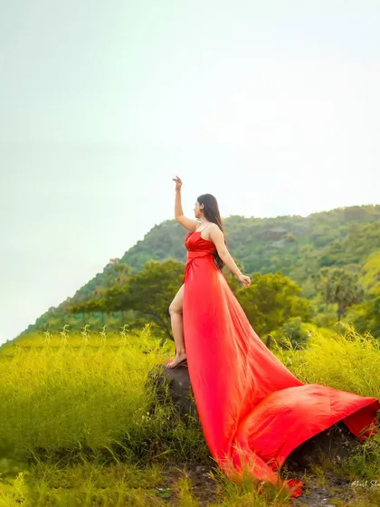 Taking fashion outdoors to create drama and movement. The flowing red gown against the raw, natural landscape makes for a powerful and cinematic image. This is perfect for brands wanting a lifestyle or campaign shoot with a story.