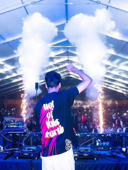 Waving to the audience amidst a storm of CO2 and sparklers.