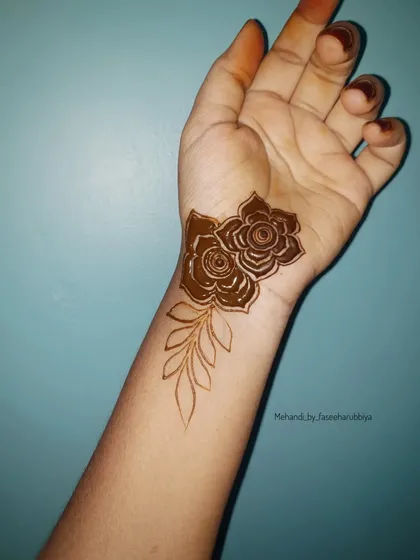 A tutorial for a simpler design, showing how to create a beautiful floral piece on the wrist.