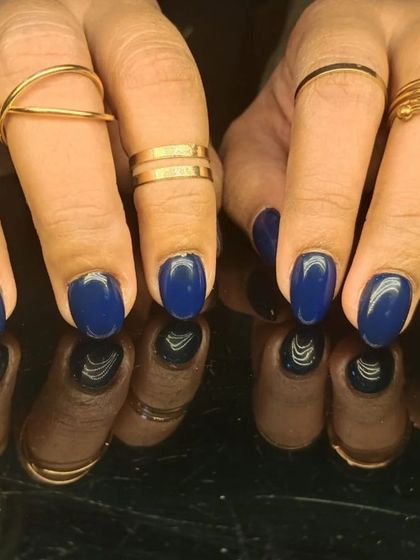 A deep and sophisticated royal blue manicure, offering a bold yet elegant look.
