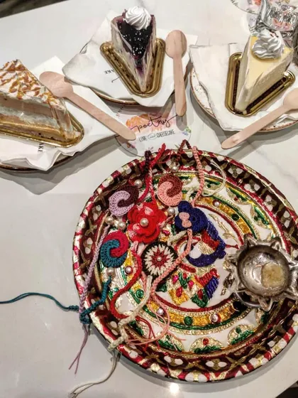A festive Rakshabandhan thali filled with our diverse collection of handmade crochet rakhis. This image captures the celebratory spirit and variety of our designs.