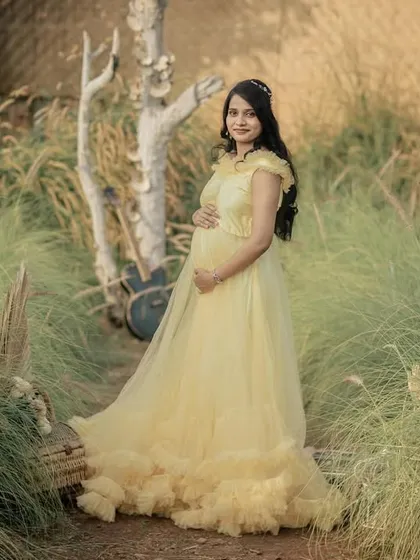 A beautiful portrait in a rustic, grassy setting. The soft light and natural elements create a warm and earthy feel.