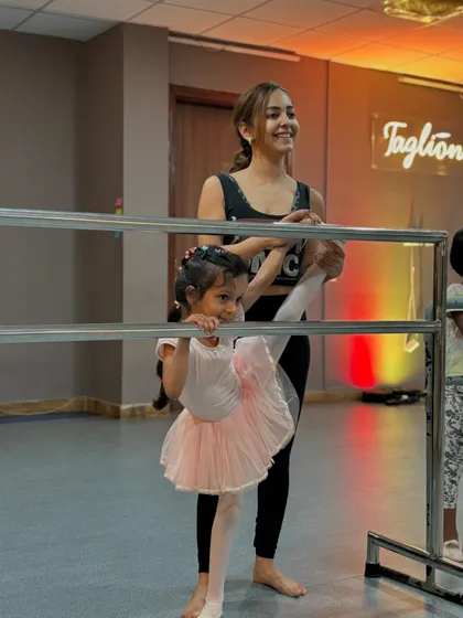 Stretching at the barre is a fundamental part of every ballet class. I love guiding my students as they build the flexibility and strength needed for graceful movements.