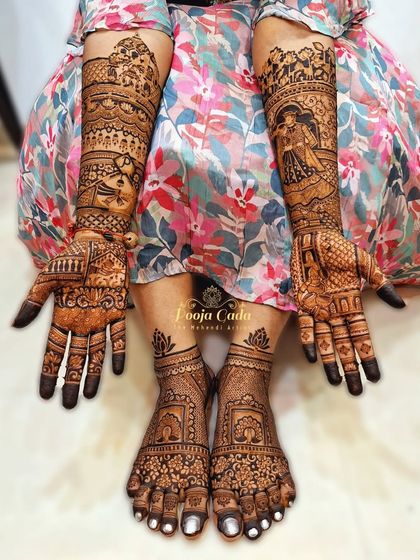 A full hands and feet mehendi for an NRI bride from the US. The design includes a mix of personal story elements and traditional motifs, creating a complete and stunning bridal look.