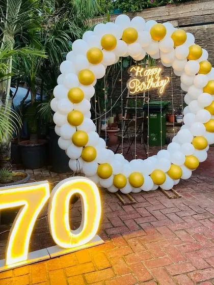 Another view of the elegant 70th birthday decoration, showing how it creates a perfect focal point in a garden or patio setting.