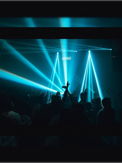 A sea of hands in the air under sharp blue beams of light. This is the visual feedback that tells me the journey is hitting all the right notes.