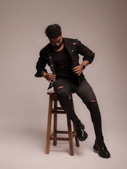 A seated pose on a stool, showing a different level and perspective for added variety in a portfolio.