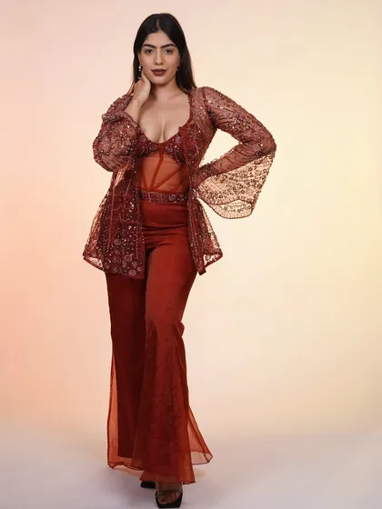 Another look at the rust-colored Indo-Western outfit, a perfect fusion of traditional embroidery and modern style.