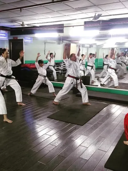 Flexibility is a key component of karate training. Here, our students participate in a guided stretching session to improve their range of motion and prevent injuries.