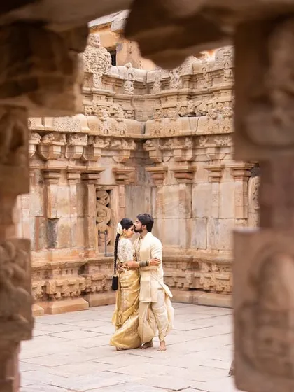 Amidst the timeless architecture of a South Indian temple, the couple shares an intimate moment. I love using grand locations to frame the personal story of your love.