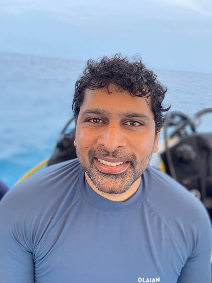 A portrait of another member of our dive crew, relaxed and happy after a day in the ocean.