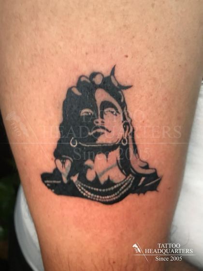 A silhouette of Ardhanarishvara, the composite form of Shiva and Parvati, representing the synthesis of masculine and feminine energies of the universe.