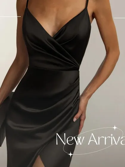 A detailed shot of the GIANNA dress, focusing on the wrap-style bodice. The ruching is strategically placed to flatter your figure.