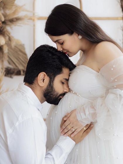 A quiet promise to the little one on the way. This close-up shot captures the deep connection and anticipation of a father-to-be.