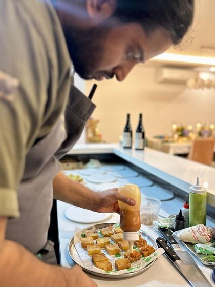 Preparing a tray of canapés for a private event. Consistency and precision are key, even for the smallest bites.