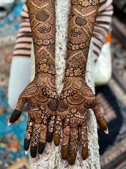 The full view of this engagement design, showing the intricate details on the palms and fingers.