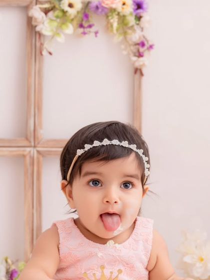 A cheeky and playful close-up from a first birthday cake smash session. It’s these little expressions that tell the biggest stories.