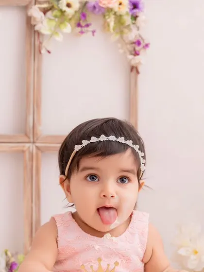 A cheeky and playful close-up from a first birthday cake smash session. It’s these little expressions that tell the biggest stories.