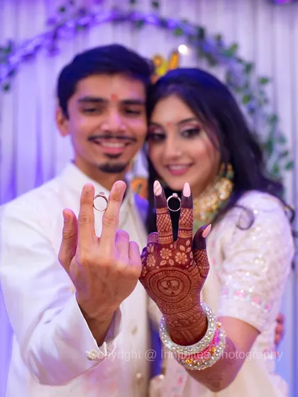 The happy couple proudly showing off their new engagement rings to the camera. This is a must-have shot that celebrates the official start of their journey together.