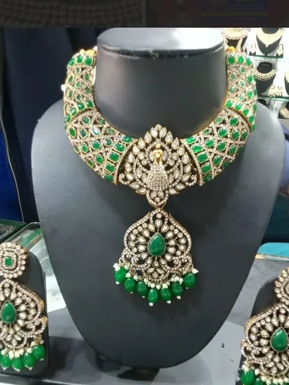 A stunning green and AD peacock-themed necklace set, beautifully displayed on a mannequin in my store.