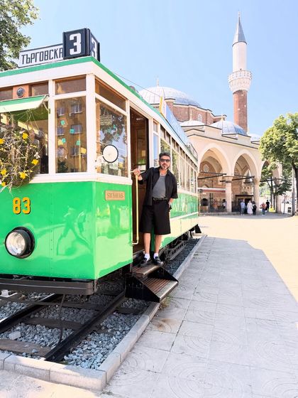 A full-length shot of my travel style in Sofia. The monochrome outfit is comfortable for walking while still looking put-together and sharp.