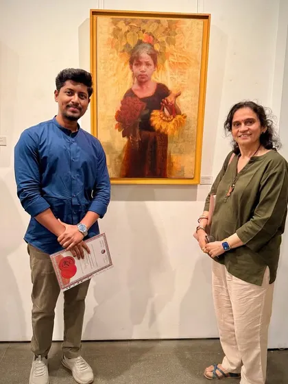 Another photo from the Kalanand Award ceremony, standing with a dignitary beside my work.
