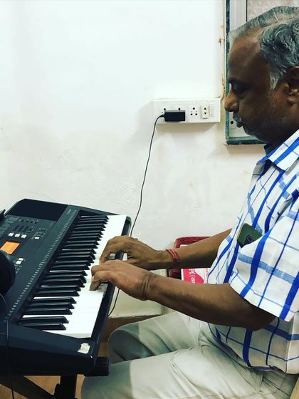 Another shot of our senior student deeply focused on his keyboard practice. His dedication is an inspiration to students of all ages in our community.