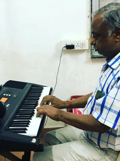 Another shot of our senior student deeply focused on his keyboard practice. His dedication is an inspiration to students of all ages in our community.