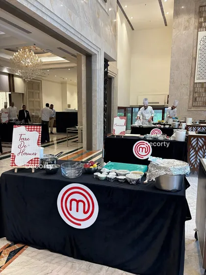 This is the Masterchef Challenge in full swing. I set up professional, branded cooking stations complete with all necessary ingredients and equipment, allowing your team to dive right into the action.