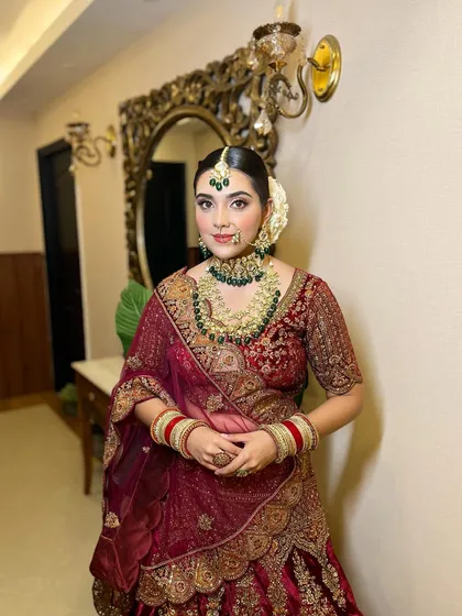 A full portrait of this beautiful bride. The makeup is kept soft and subtle to let her natural beauty and stunning jewelry shine.