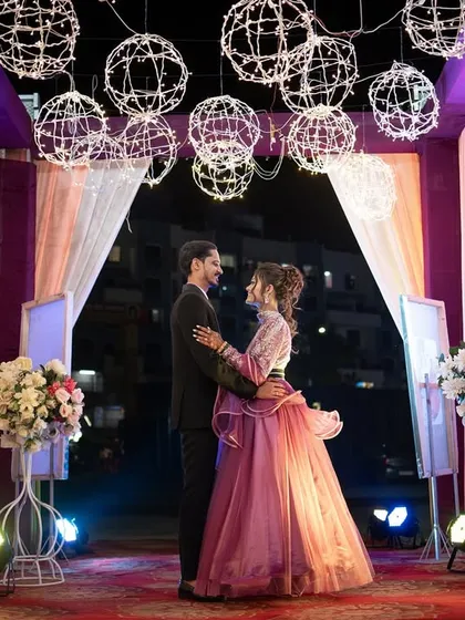 The couple sharing a quiet moment together amidst the Sangeet decorations.