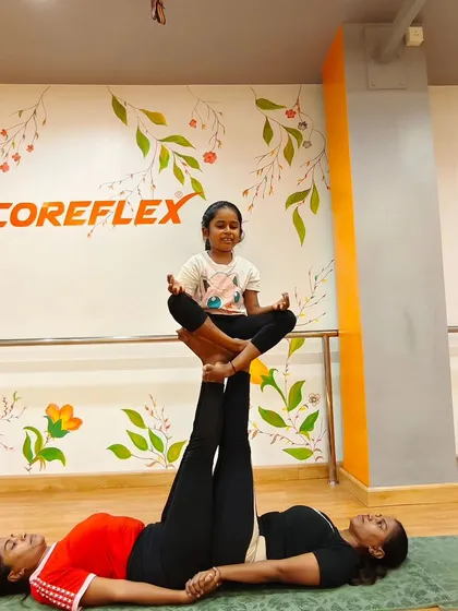 Yoga is for everyone, and our studio is a space for families to connect. Here, a mother and daughter duo team up for a partner pose, showing that strength, balance, and fun can be a shared journey.