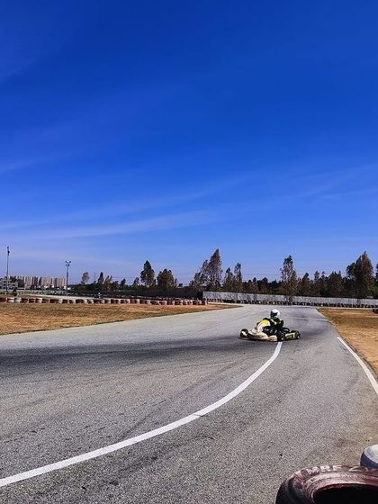 A wide shot of the Meco Kartopia track during a pre-season test day. The clear blue sky and empty track provide the perfect conditions for focused, uninterrupted practice.