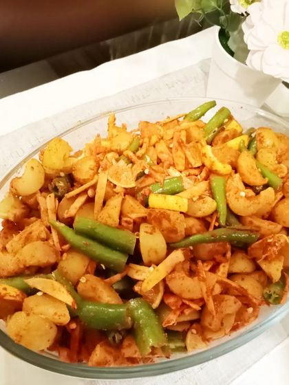 This is our special mixed pickle with lemon, green chillies, and ginger. It’s a healthy and tasty combination that is great for digestion.