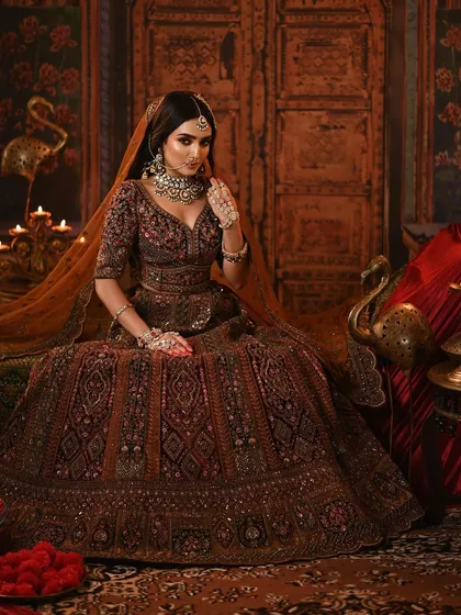 A slightly different angle, showing the beautiful drape of the dupatta and the intricate details of the lehenga.